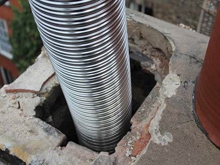 Interior chimney flue documented for repair