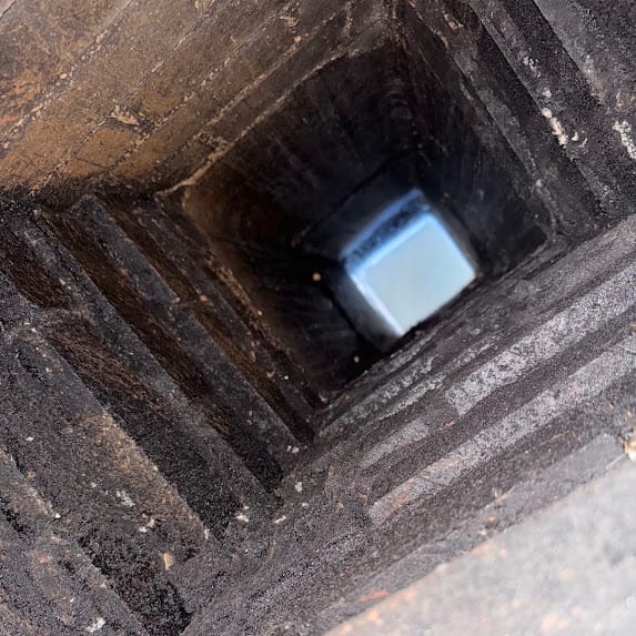 Residential chimney being evaluated for a possible water-entry problem
