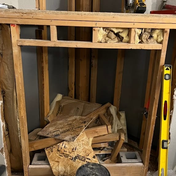 Residential fireplace opened for repair work