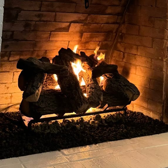 Residential fireplace being checked for smoke and draft problems