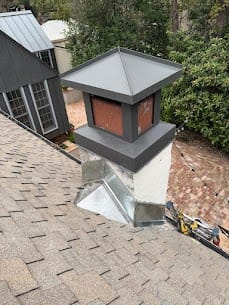 Residential fireplace being checked for the source of an odor