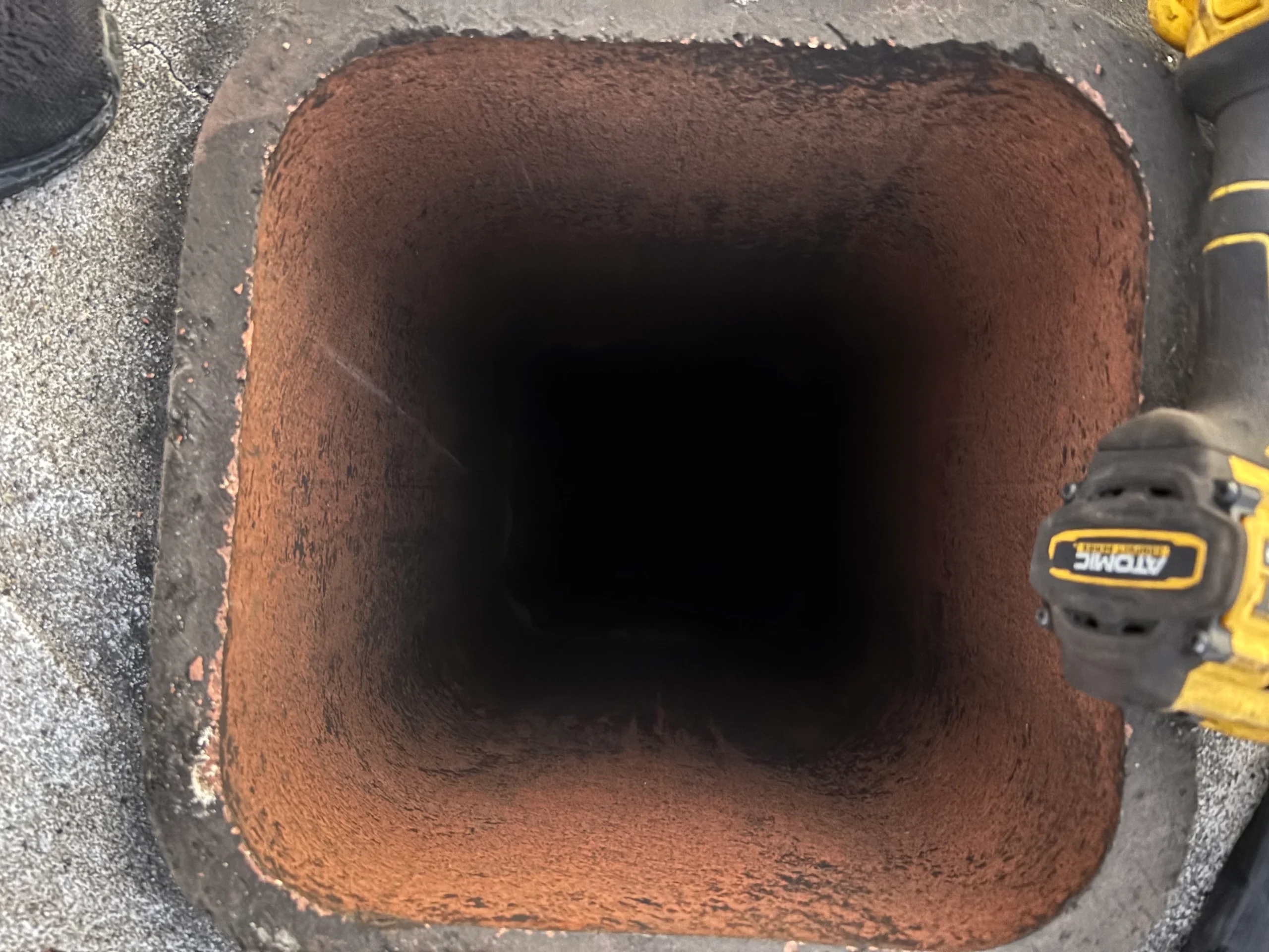 Interior view of a residential chimney flue during an inspection